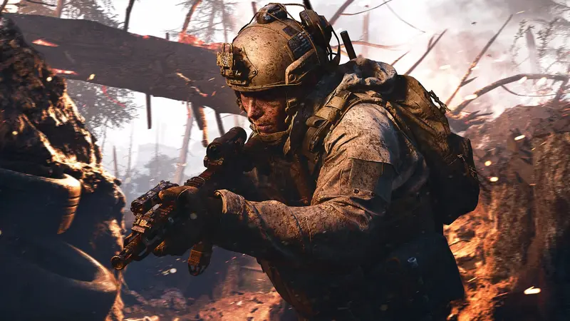 A Modern Warfare 4 soldier in dusty fatigues aims a scoped rifle while crouched in a trench cut through a burning forest