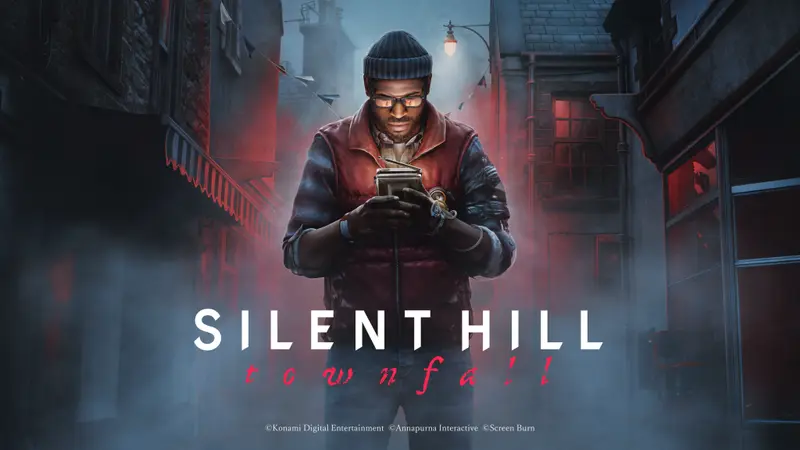Silent Hill: Townfall key art: a man in a beanie and glasses stands in a fog-filled, red-lit street holding a small handheld television that lights his face from below.